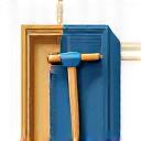 An icon of a wooden frame with a hammer and chisel.
